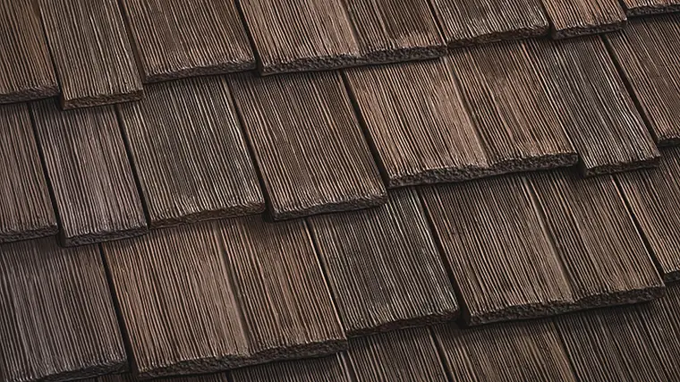 CeDUR Walden synthetic cedar shake, a greyed brown with mixed light and dark tones across the courses