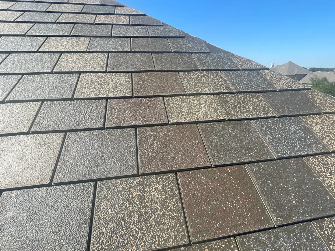Close-up of F-Wave REVIA synthetic shingles in a multi-tone slate color